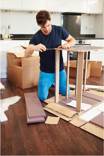 Person assembling flat-pack furniture